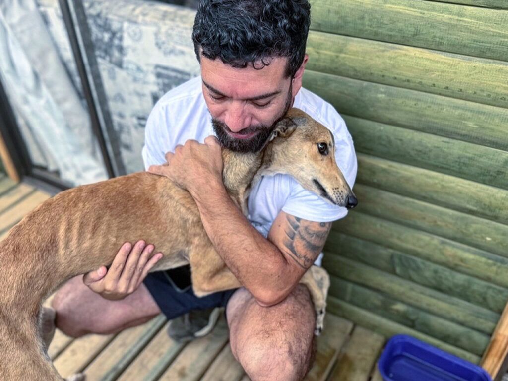 Luis with a rescued greyhound. | Photo courtesy of Luis 