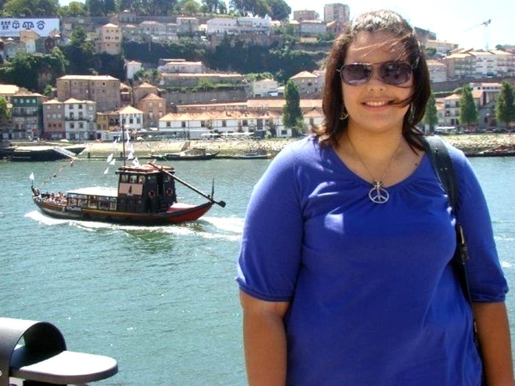 Keyla posing for a portrait on the waterfront.