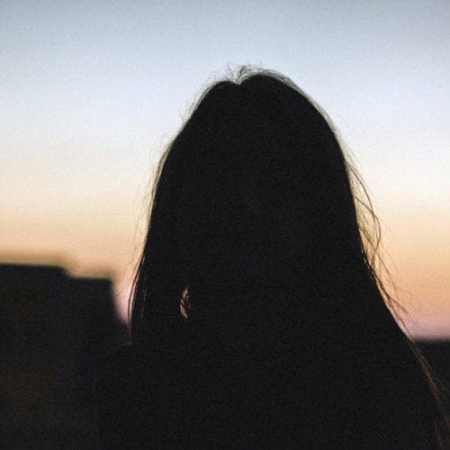 Woman in the shadows. Anonymous photo.